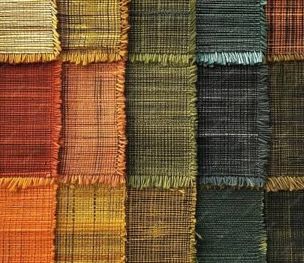Woven fabric is any textile made by interlacing two sets of yarns at right angles—the vertical warp and horizontal weft—typically on a loom