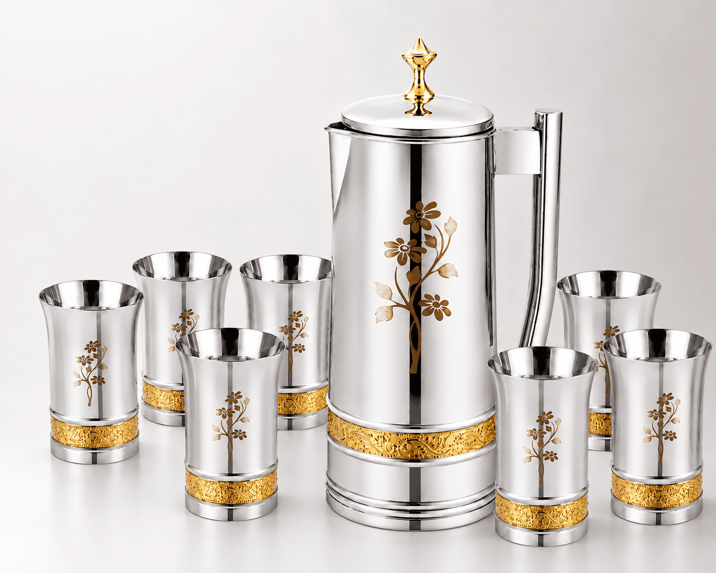 A premium stainless steel water jug featuring a mirror-polished finish, a gold-toned laser-printed floral motif, and a decorative lid knob.